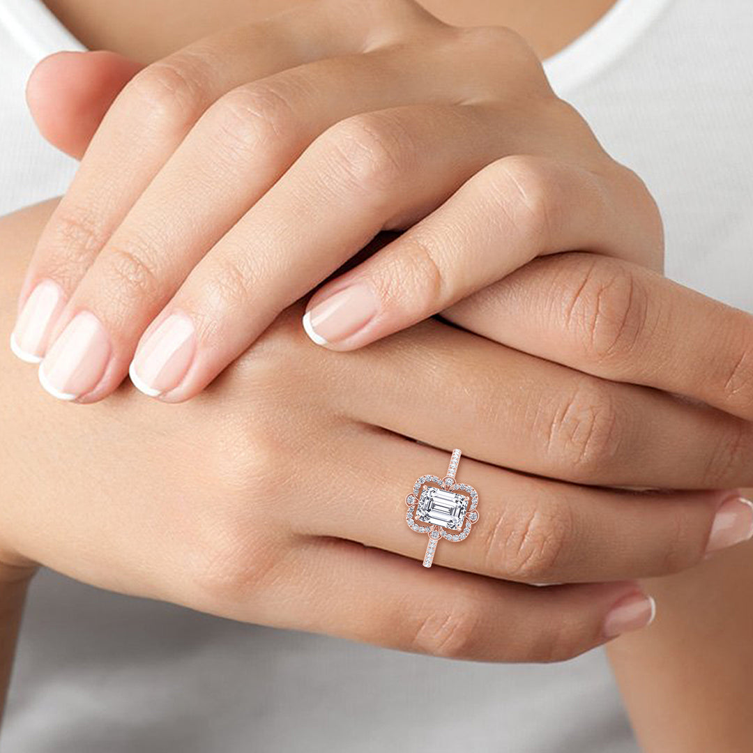 Vintage Style Emerald Cut Engagement Ring with Round Cut Sidestones