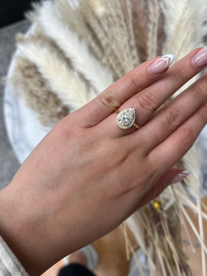 Pear Shape Engagement Ring with Halo Center and Plain Band