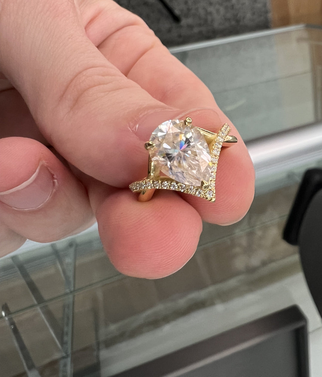 Pear Shape Engagement Ring With Twisted Pavé Band