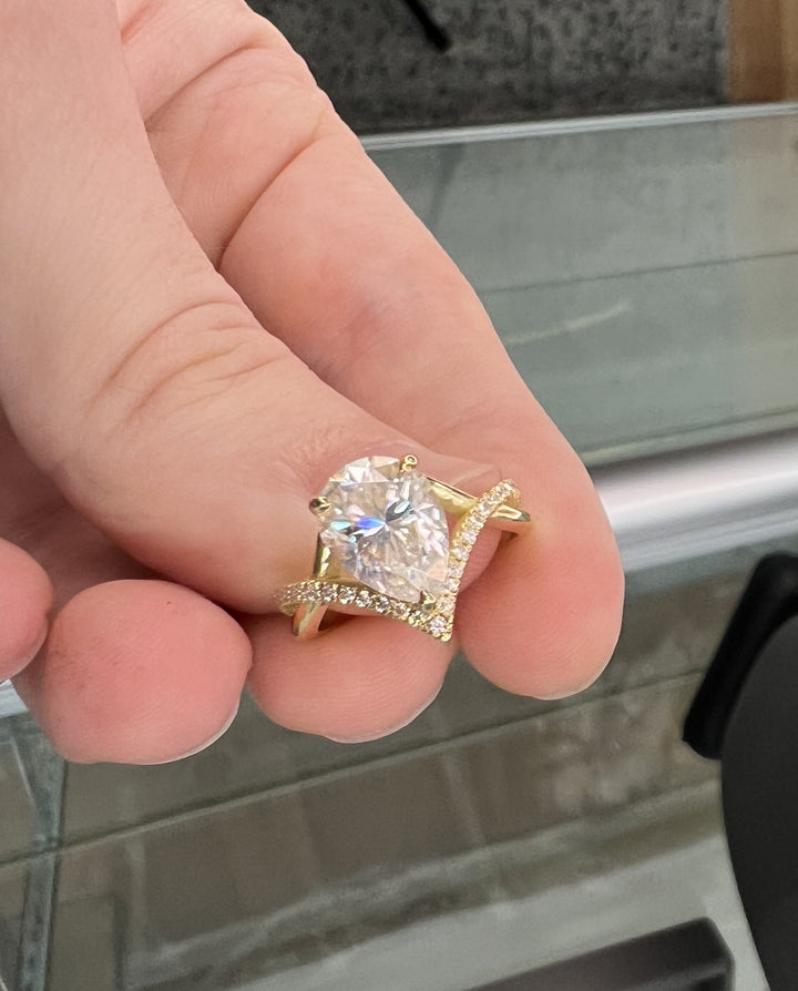 Pear Shape Engagement Ring With Twisted Pavé Band