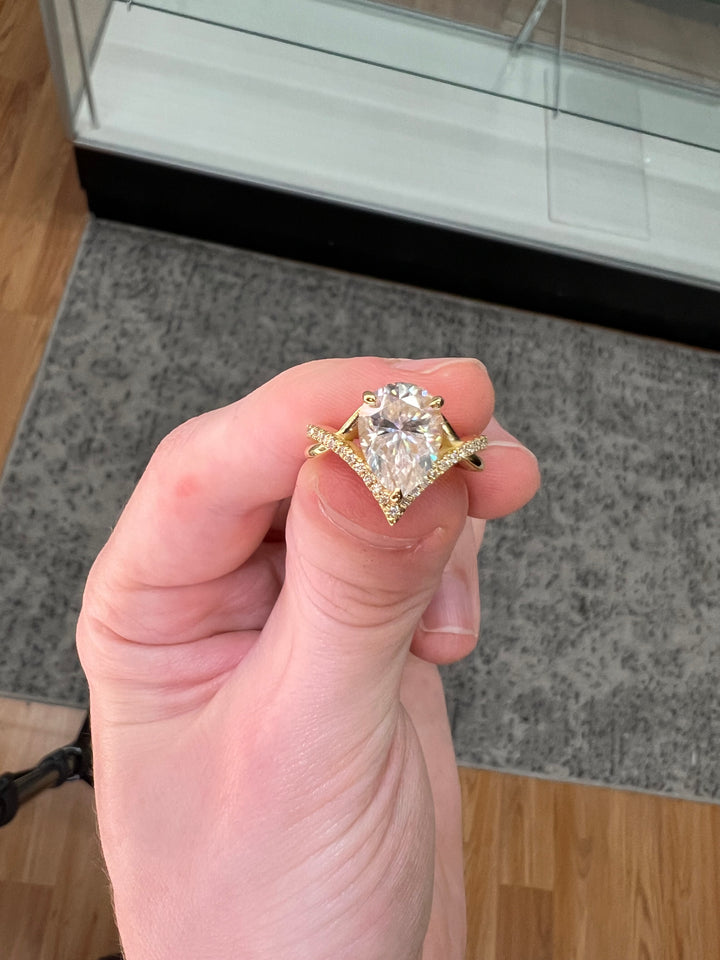 Pear Shape Engagement Ring With Twisted Pavé Band