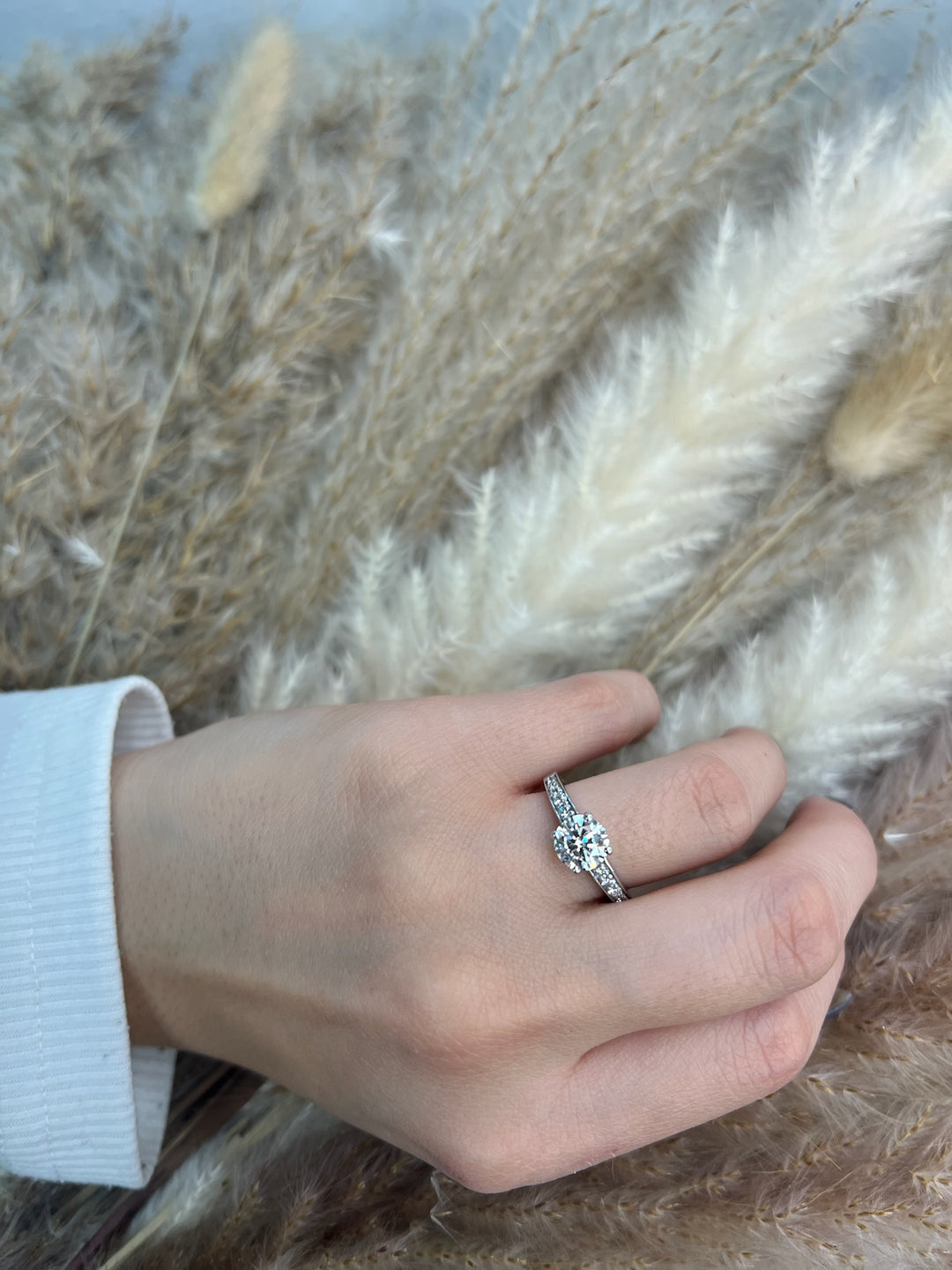 Round Cut Engagement Ring with Sidestones