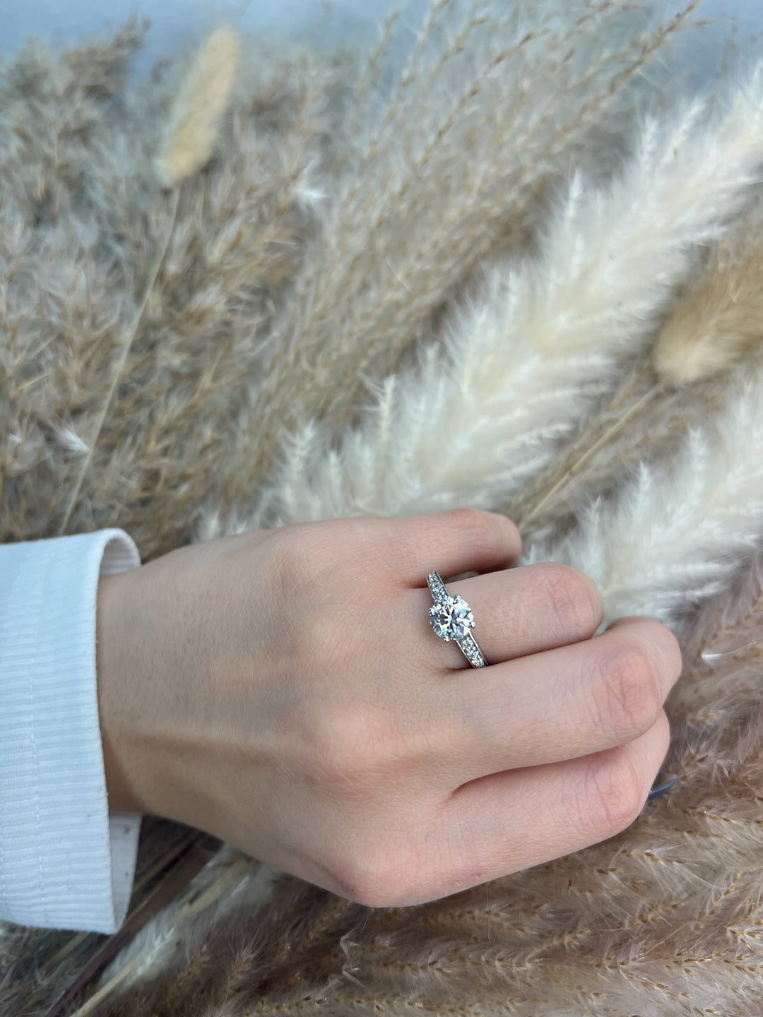 Round Cut Engagement Ring with Sidestones