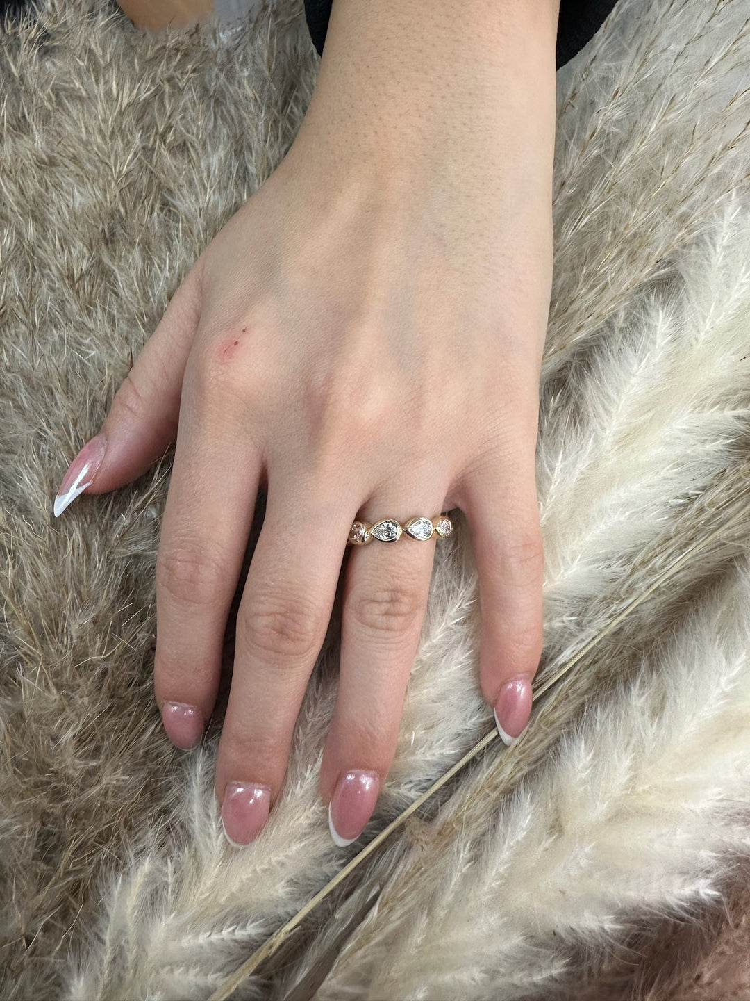 Bezel Set East To West Pear Shape Eternity Band