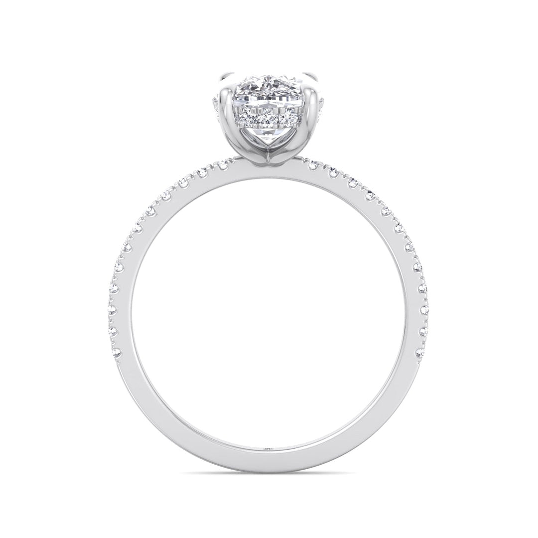 Elongated Cushion Cut Engagement Ring With Sidestones and Hidden Halo