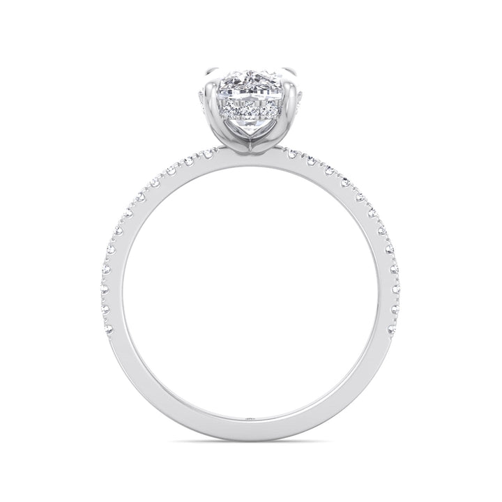 Elongated Cushion Cut Engagement Ring With Sidestones and Hidden Halo