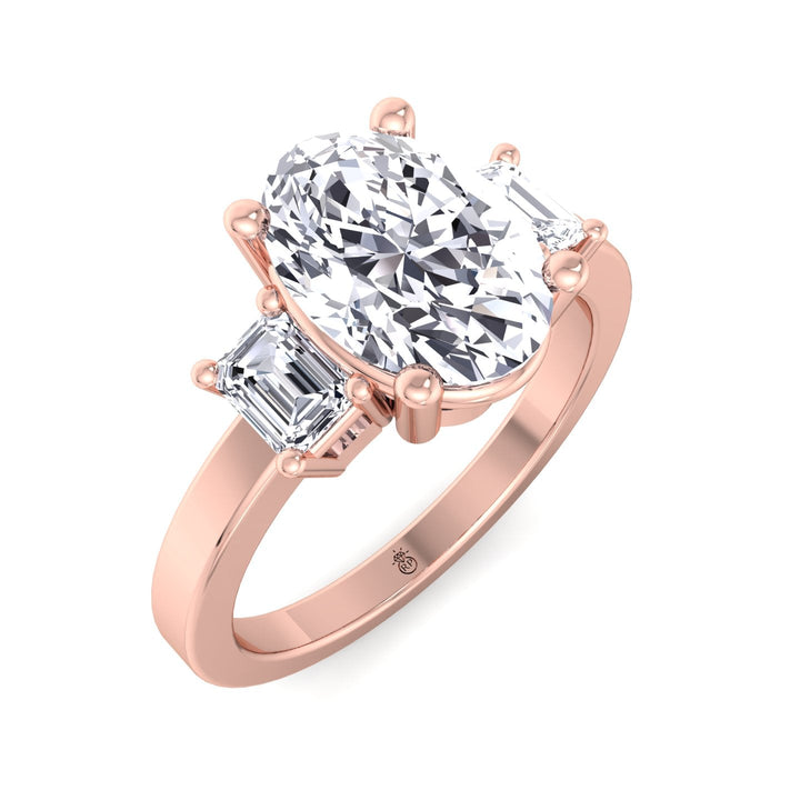 Oval Cut Engagement Ring with Emerald Side Stones