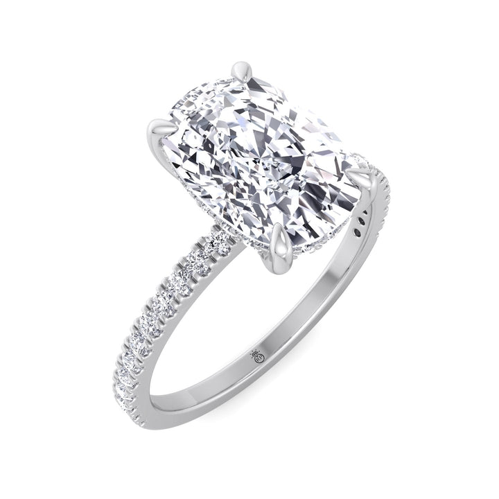 Elongated Cushion Cut Engagement Ring With Sidestones and Hidden Halo