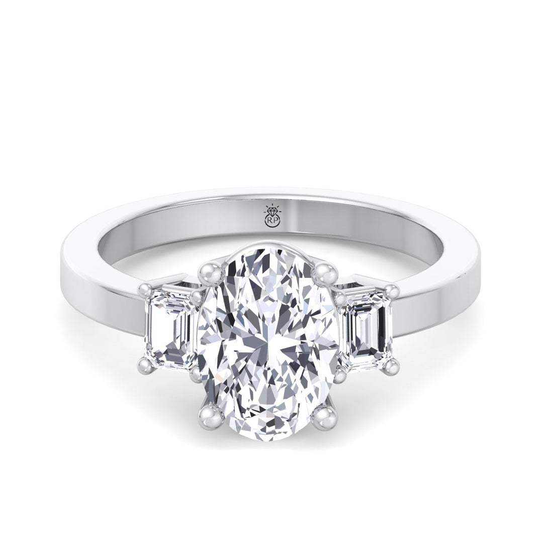 Oval Cut Engagement Ring with Emerald Side Stones