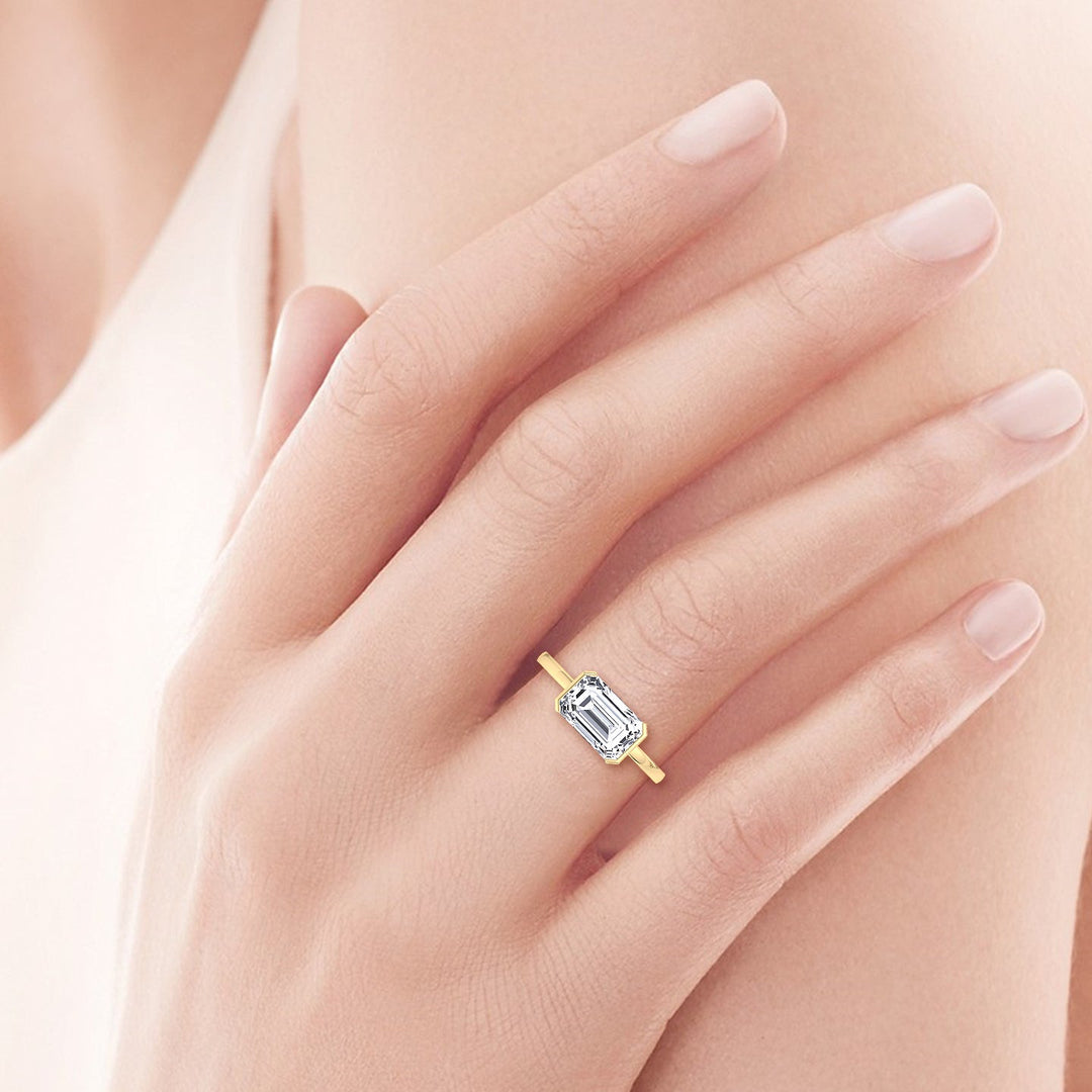 Bezel Set Emerald Cut Engagement Ring East to West