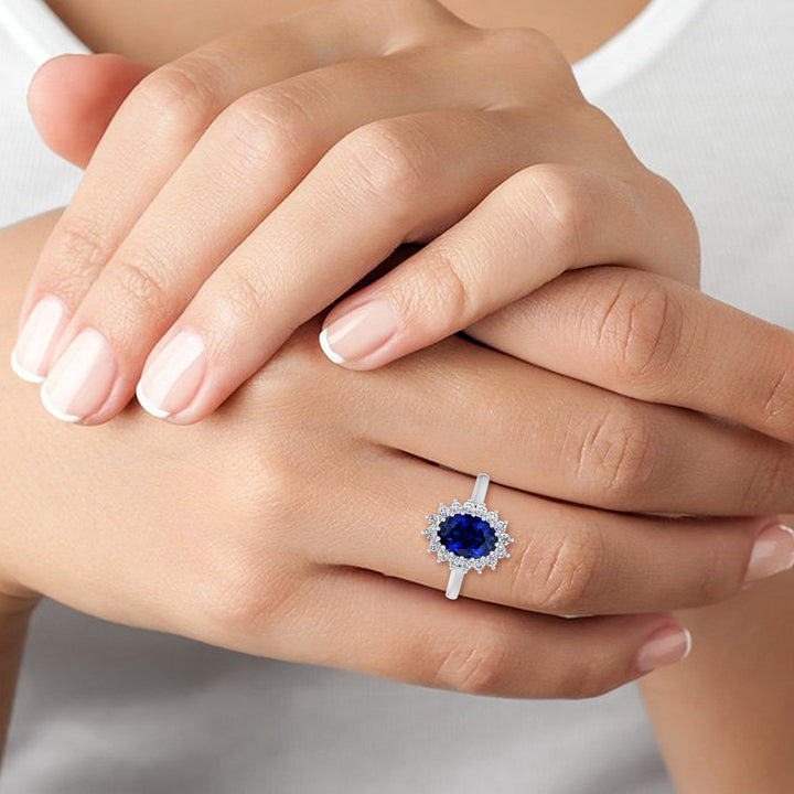 Oval Cut Blue Sapphire &amp; Halo Engagement Ring