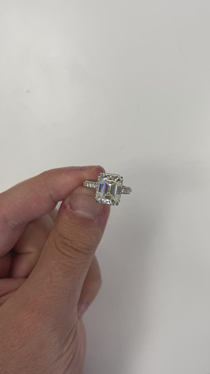 Emerald Cut Engagement Ring with Sidestones and Hidden Halo