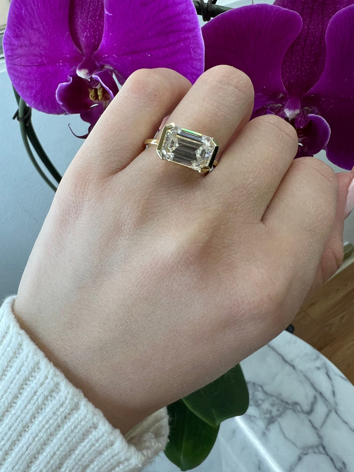Bezel Set Emerald Cut Engagement Ring East to West