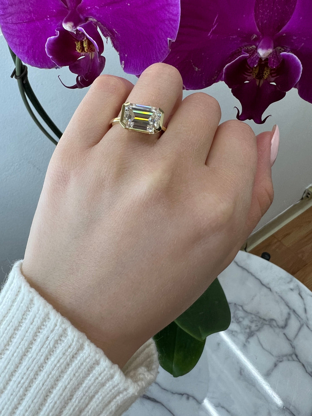 Bezel Set Emerald Cut Engagement Ring East to West
