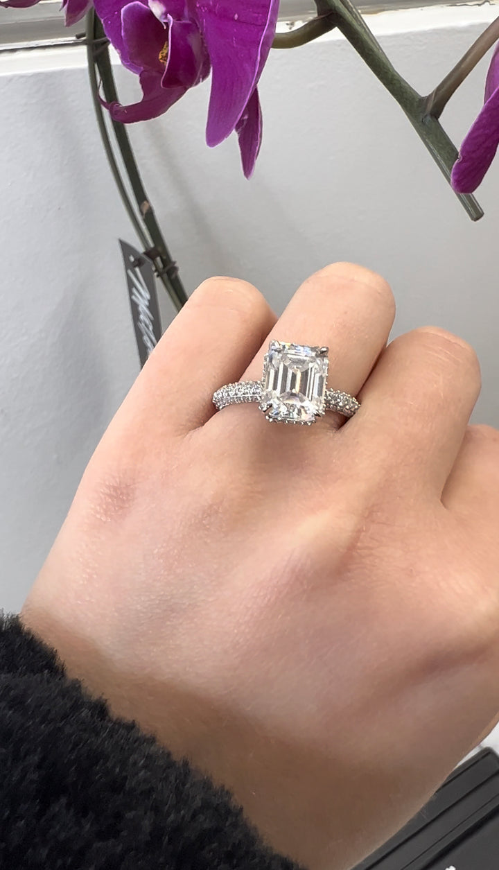 Emerald Cut Engagement Ring with Sidestones and Hidden Halo