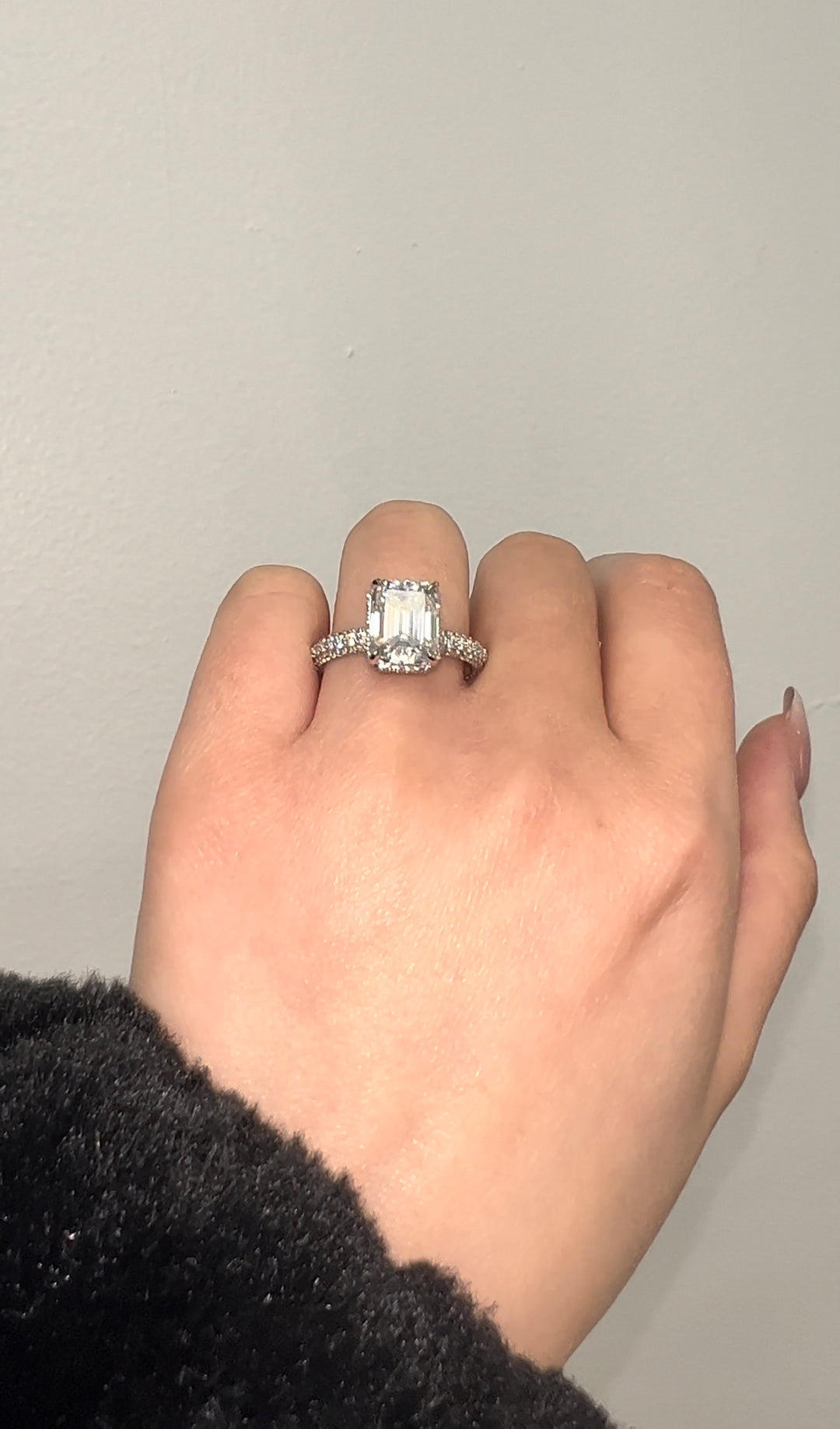 Emerald Cut Engagement Ring with Sidestones and Hidden Halo