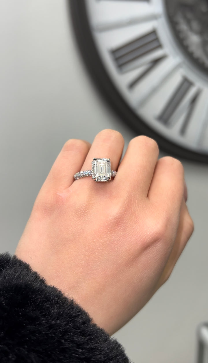 Emerald Cut Engagement Ring with Sidestones and Hidden Halo