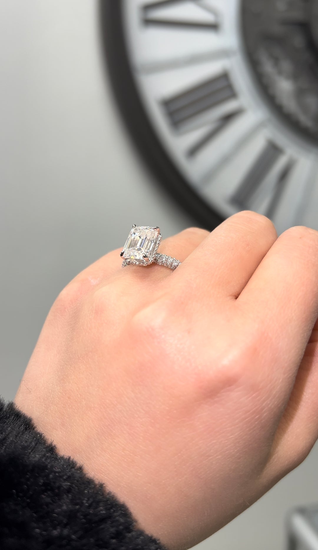 Emerald Cut Engagement Ring with Sidestones and Hidden Halo