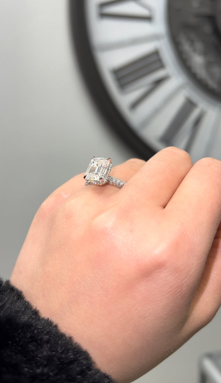 Emerald Cut Engagement Ring with Sidestones and Hidden Halo