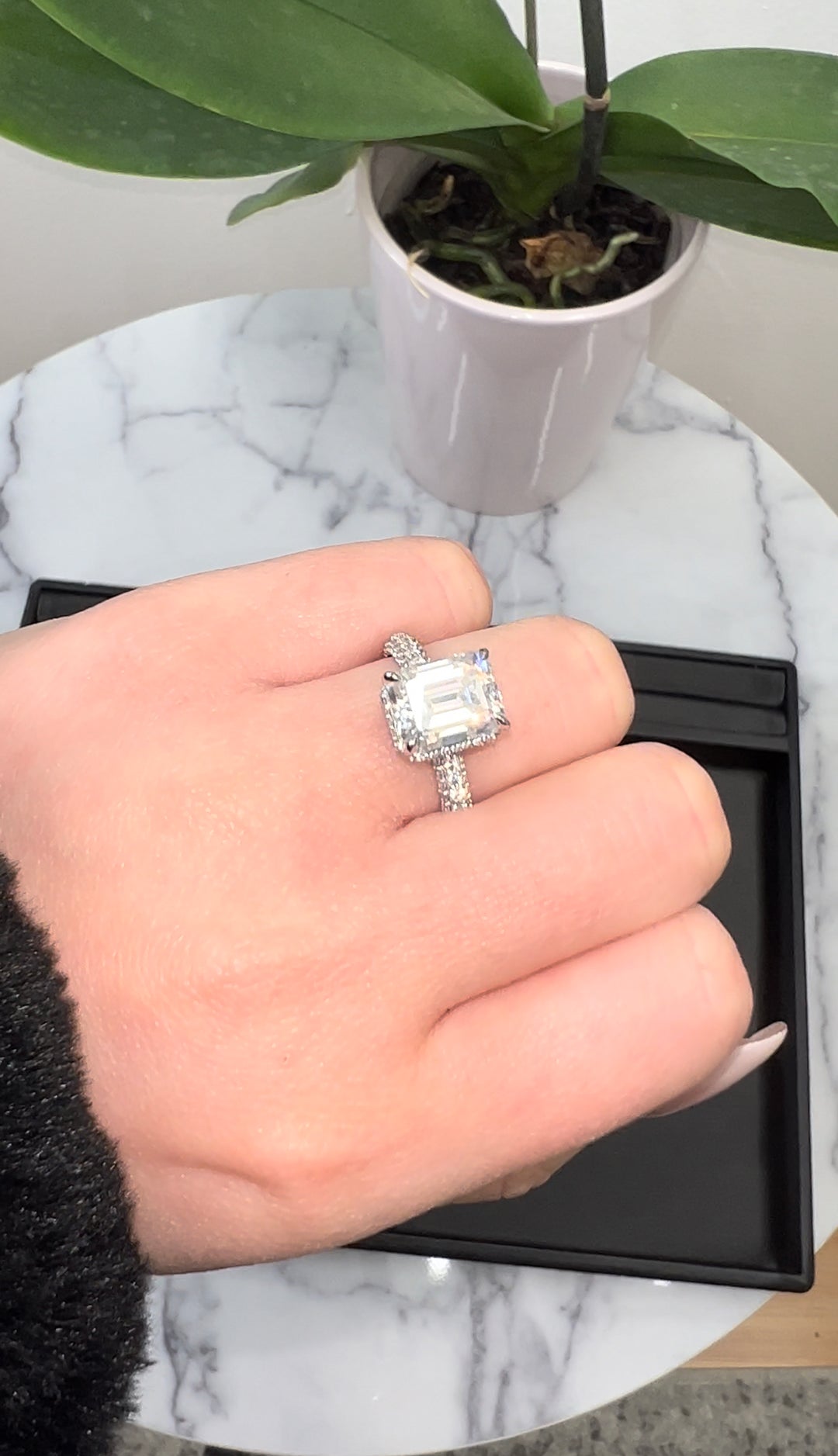 Emerald Cut Engagement Ring with Sidestones and Hidden Halo