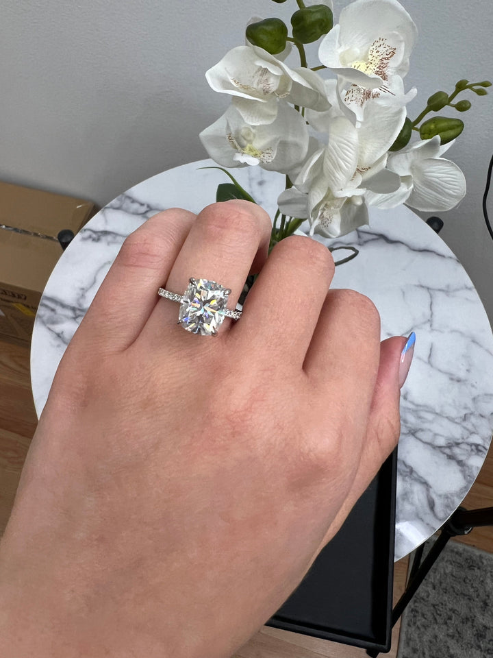 Elongated Cushion Cut Engagement Ring With Sidestones and Hidden Halo