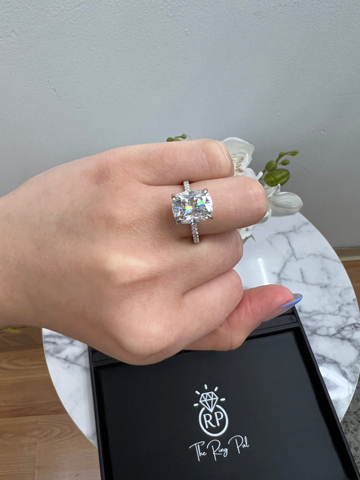 Elongated Cushion Cut Engagement Ring With Sidestones and Hidden Halo
