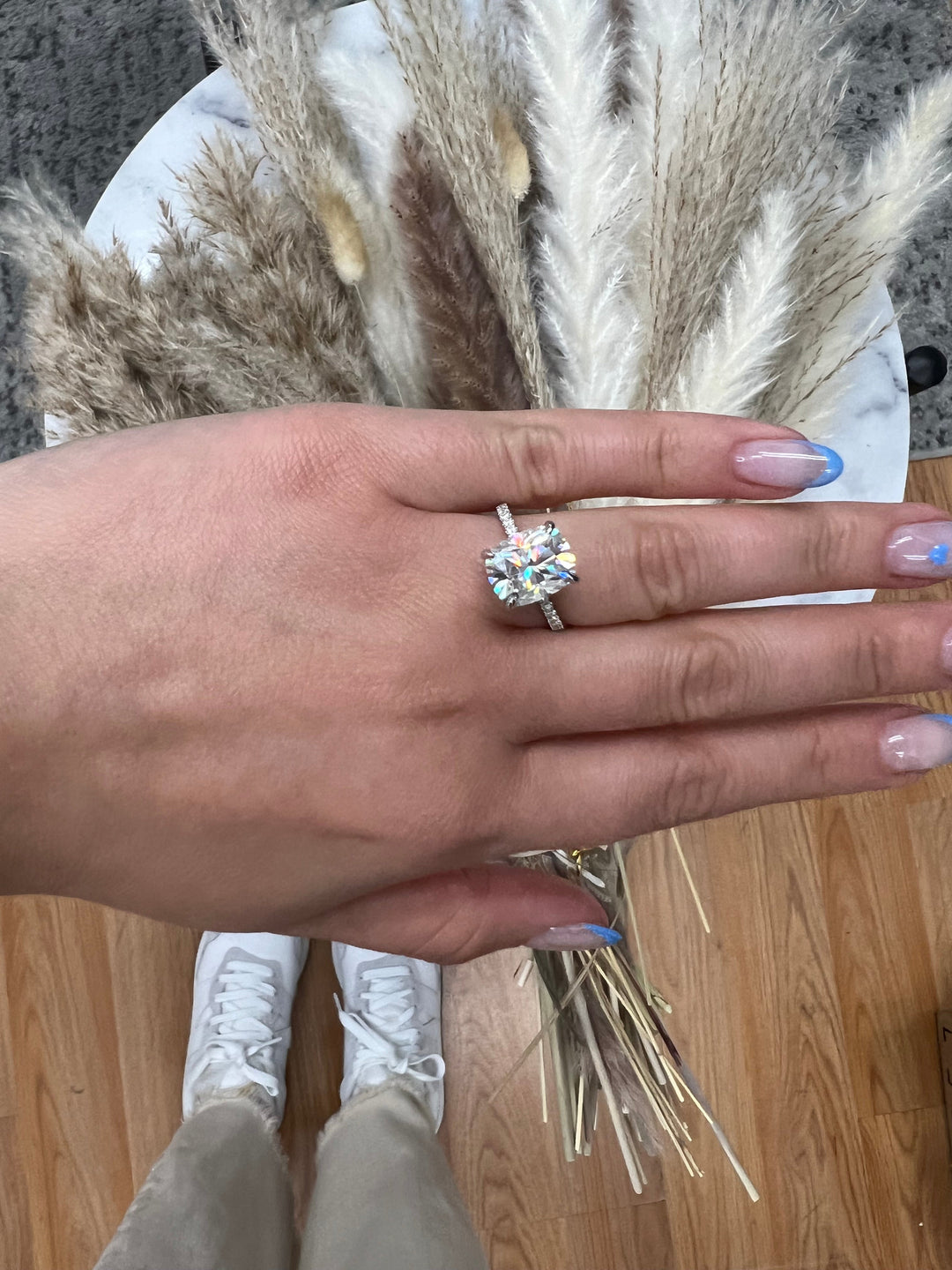 Elongated Cushion Cut Engagement Ring With Sidestones and Hidden Halo