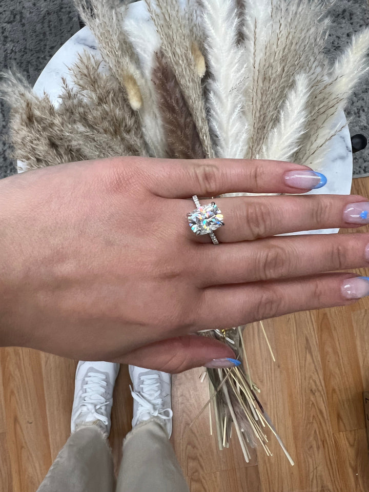 Elongated Cushion Cut Engagement Ring With Sidestones and Hidden Halo