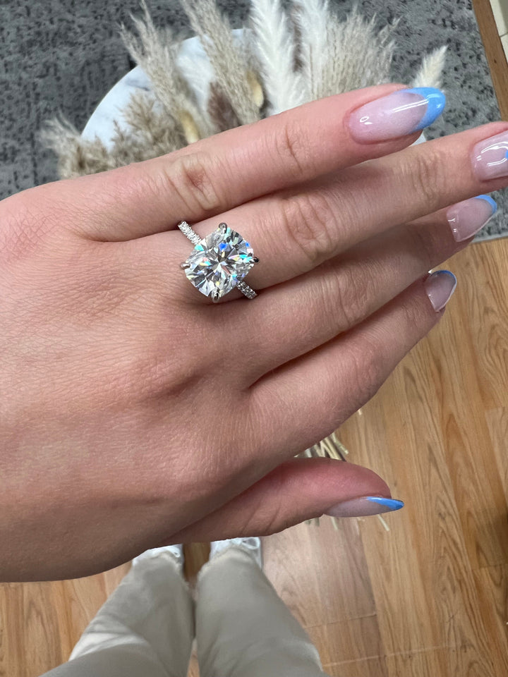 Elongated Cushion Cut Engagement Ring With Sidestones and Hidden Halo