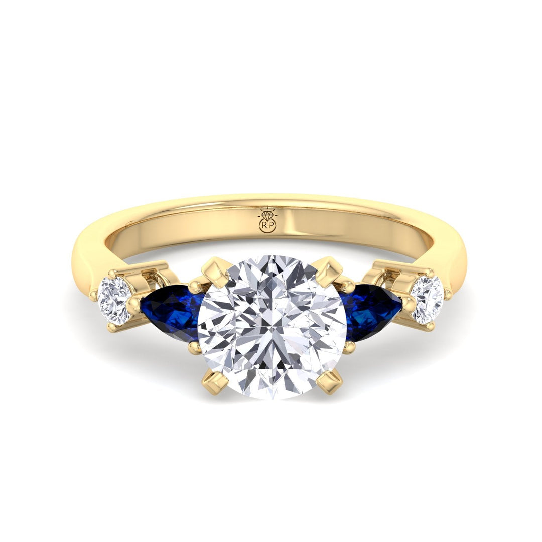 Round Cut Engagement Ring with Blue Sapphire Pear Shape Sidestones